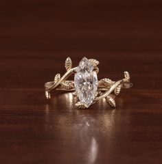 a close up of a ring on a table with a wooden surface in the background