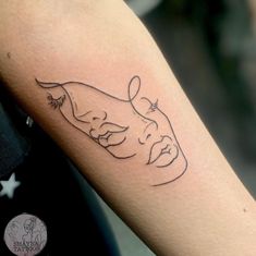 a tattoo on the arm of a person with a cow in it's head