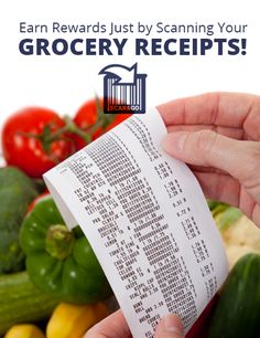 a hand holding a receipt in front of vegetables