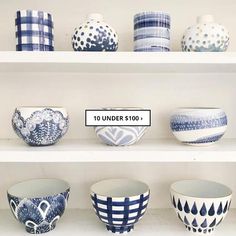 the shelves are filled with bowls and vases