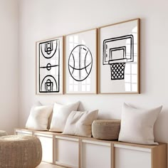 three framed pictures hang on the wall above a wooden bench with pillows and throw pillows