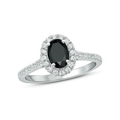 This 1/3 ct. t.w. diamond engagement ring set in 10K white gold features a 7.0 x 5.0mm oval-shaped lab-created black sapphire center stone. A frame of petite round diamonds surrounds the center stone and line the rings shank. Black Diamond Engagement Ring Simple, Kay Jewelers Engagement Rings, Shiney Things, Kays Engagement Ring, Cute Promise Rings, White Diamond Rings Engagement, Black Engagement Ring, Raw Gemstone Ring, Diamond Frame