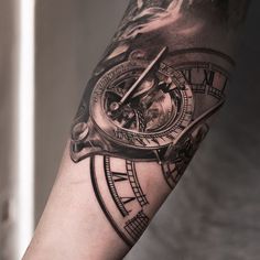 a person with a clock tattoo on their arm