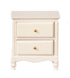 a white nightstand with two drawers and gold knobs on the bottom, against a white background