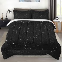 a black and white bed with stars on it