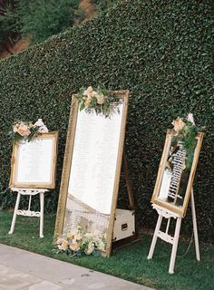 a couple of mirrors sitting next to each other on top of a grass covered field