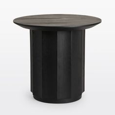 a round table with black wood in the middle