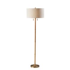 a floor lamp with a white shade on it's base and a gold metal base