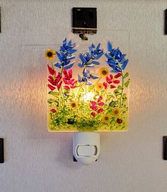 Not all Etsy sold nightlights are created equally. Everything from my shop is created by me in my Utah studio. Not outsourced to other countries or people! Texas bluebonnets and Indian paintbrush wildflowers.  This fused glass night light features Texas bluebonnets, Indian paintbrush and sunflowers. Stunning bright wildflowers look beautiful during the day as well.  Please see my shop for other night lights selections. My apologies for those of you that loved the LED light base option, but due to lack of availability from my supplier, this option is no longer available.  Please consider purchasing a LED replacement bulb or incandescent Christmas bulb if the provided clear bulb is too bright. Soft light provides just the right amount of light in bathroom,  baby's room, kitchen, hallways and Light In Bathroom, Stained Glass Night Lights, Indian Paintbrush, Glass Fusion Ideas, Texas Bluebonnets, Fused Glass Artwork, Fused Glass Ornaments, Fused Glass Jewelry, Glass Projects