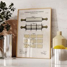 a framed poster on the wall shows different types of kitchen utensils