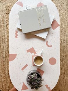 an overhead view of a table with coffee and plants