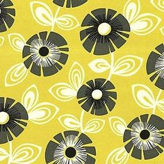 a yellow and black flower pattern with white circles on it's center is shown