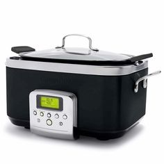 the crock pot is red and silver with a digital display on it's side