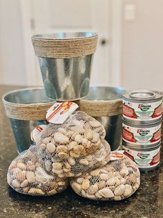 several cans and bags of food sitting on a counter