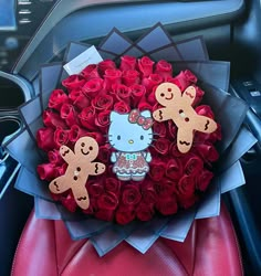 a hello kitty bouquet with red roses and teddy bears in the center is surrounded by paper flowers