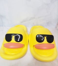 ABOUT US:  Thank you for choosing What The Duck Cruising, the one stop duck shop!  We specialize in all things ducks and cruising!  Please feel free to reach out to us with any questions and we will be happy to help! ABOUT THE PRODUCT: Get ready to quack up with these super cute and comfy duck slippers! Featuring a bright yellow body, a pair of cool sunglasses, and a friendly smile, these slippers are perfect for adding a touch of fun to your day. They're made from soft, durable materials and fe Duck Slippers, What The Duck, Pool Shoes, Womens Slides, Kids Slide, Cool Sunglasses, Heart For Kids, Easy Wear, Slide Sandals