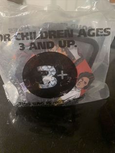 there is a plastic bag that has some children's ages on it in it