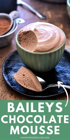 bailey's chocolate mousse recipe on a black plate with spoon and bowl in the background