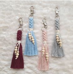 three tasseled key chains with wooden beads