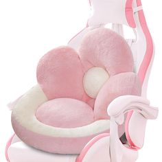 a pink and white baby's rocking chair with a stuffed animal in the seat