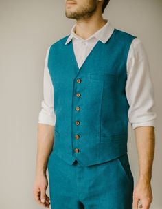 "Our rustic wedding waistcoat stands as an example of our commitment to quality. Each one is handmade, with an exclusive focus on tailoring to the unique measurements of our customers. We firmly prioritize craftsmanship over mass production, ensuring that every creative and sewing task is duly recognized and rewarded. DESCRIPTION. Our rustic wedding waistcoat has buttons in the front, three pockets, and a double layer in the front. This vest blends modern and timeless styles, so it's a great add Tailored Sleeveless Suit For Wedding, Tailored Sleeveless Wedding Suits, Sleeveless Vest With Buttons For Wedding, Tailored Sleeveless Three-piece Suit For Wedding, Fitted Vest With Buttons For Wedding, Fitted Wedding Vest With Buttons, Fitted Wedding Vest, Classic Tailored Wedding Vest, Fitted Sleeveless Nehru Jacket For Wedding