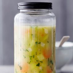 a jar filled with food sitting on top of a table