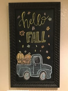 a chalkboard with the words hello fall written on it and a truck carrying pumpkins