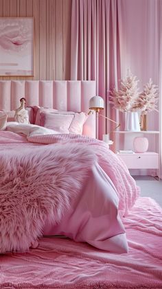 a bedroom with pink bedding and fur on the comforter is shown in this image