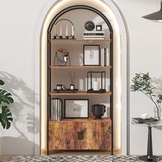 an arch in the wall is filled with books and other items, including vases