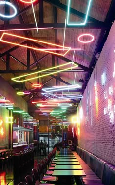 an empty restaurant with neon lights hanging from the ceiling and long tables lined up along the wall