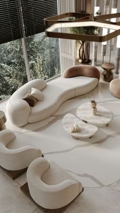 a living room filled with lots of white furniture