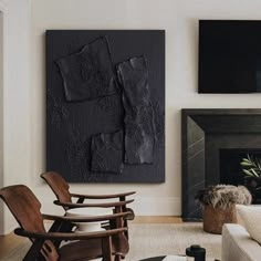 a living room filled with furniture and a fire place in front of a painting on the wall