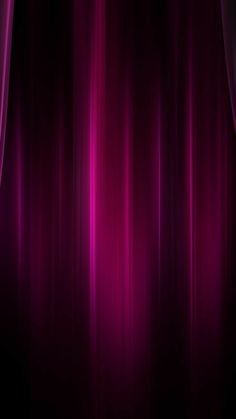 a dark background with pink and purple curtains