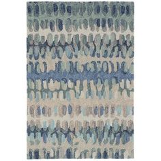 an area rug with blue and beige colors