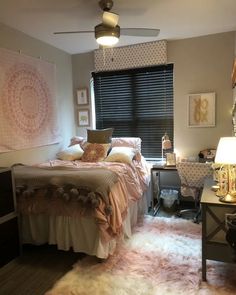 a bed room with a neatly made bed next to a window