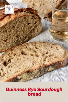 a loaf of bread sitting on top of a table next to a glass of water