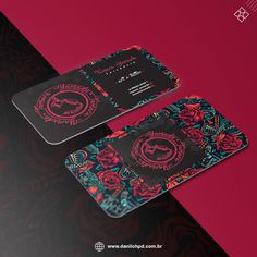 two business cards with floral designs on them