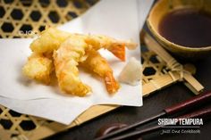 fried shrimp sticks with dipping sauce and chopsticks