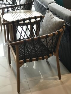 chairs and tables are lined up on the floor in a room with white tile floors