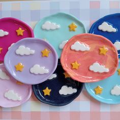 several plates with clouds and stars painted on them