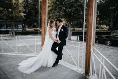 a bride and groom pose for a wedding photo