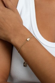 Our first ever touch of gemstone is here! The Moonstone Drop Bracelet features the gemstone symbolizing wisdom, intuition, and protection on a dainty curb chain. We hope this brings you inspiration with every wear. STYLING TIP: Go for a dainty look by pairing with the Kate Bracelet, and create a unique & detailed stack. 18k gold-plated brass 1.75mm chain width 4mm x 7mm genuine moonstone As with all natural gemstones, there will be variations in coloring Available in 4 lengths 5.5" plus 1.5" ext Curb Chain, Gold Plating, Women's Jewelry, Moonstone, Jewelry Pieces, All Natural, Natural Gemstones, Size Guide, Gold Bracelet