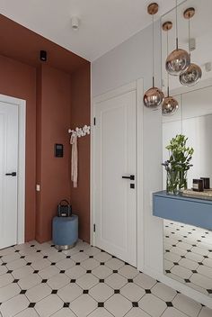 a bathroom with tiled flooring and orange walls