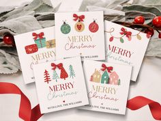 four christmas cards with red ribbon on top of them next to holly leaves and decorations