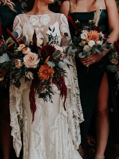 three bridesmaids holding bouquets in their hands