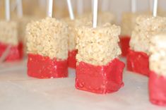 red and white cake pops with marshmallows on them are ready to be eaten