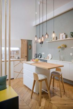 the kitchen is clean and ready to be used as a dining room or living room