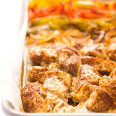 a casserole dish filled with meat and vegetables