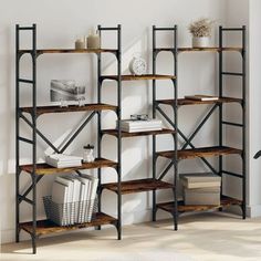 This bookshelf is a great helper to organizing clutter as well as a timeless addition to your home decorAmple storage spaceThe book rack features open shelves at different heights and provides ample storage space for you to store and display your booksmagazinesdecorative itemspicture framesholiday souvenirs and trophies while enhancing your living spaceSturdy constructionThe powder-coated steel and engineered wood ensure a sturdy construction for the storage rack and provide your Wood Book Shelves, Oak Bookshelves, Large Bookcase, Book Rack, Freestanding Storage, Furniture Bookshelves, Etagere Bookcase, Wood Book, Standing Shelves