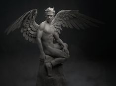 a statue of a man with wings sitting on top of a rock in the dark